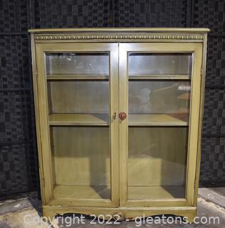 Display Cabinet with Double Glass Doors with an Antique Avocado Green Finish 